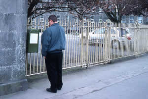 fig 2: Reading the text titled 'Mulgrave 
Street' fly-posted outside of Saint Joseph's Mental Hospital. Click here to view 