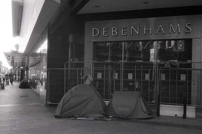 Fig. 22 Debenhams closes leaving many unemployed, Homeless people camp under the overhang at its entrance and frontage. June 2020.